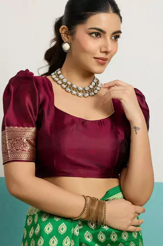 Green banarasi silk blend zari woven saree with unstitched blouse piece