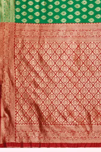 Green banarasi silk blend zari woven saree with unstitched blouse piece