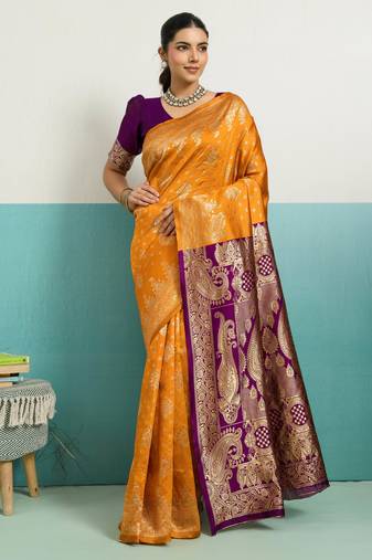 Mustard banarasi art silk blend zari woven saree with unstitched blouse piece