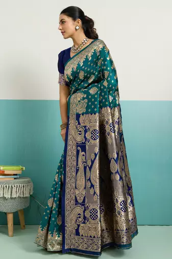 Teal banarasi art silk blend zari woven saree with unstitched blouse piece