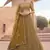 mustard net embroidered Lehenga set
