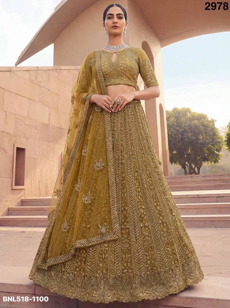 mustard net embroidered Lehenga set