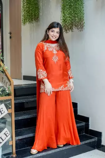 orange embroidered crepe sharara suit set with dupatta