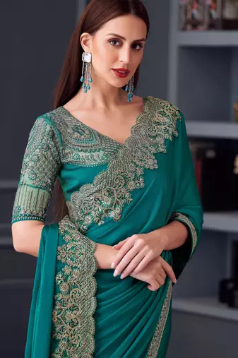 Teal silk blend chiffon embroidered saree with unstitched blouse piece