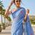 Blue linen printed saree with unstitched blouse piece