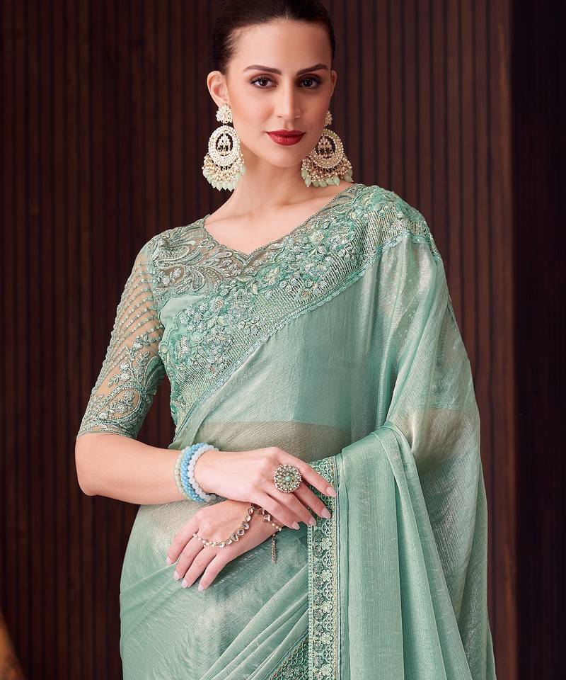 Sea green soft silk blend embroidered saree with unstitched blouse piece