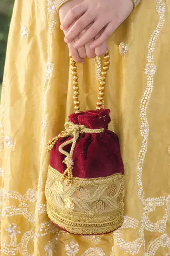 Maroon silk designer potli bag for women with golden embroidery 