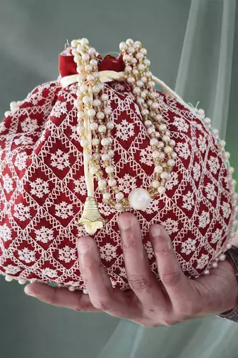 Maroon embroidered potli bags – handcrafted wedding potli with beads 