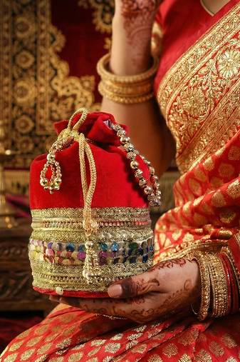 Red silk designer potli bag – golden embroidery & pearl handle