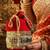 Red silk designer potli bag – golden embroidery & pearl handle