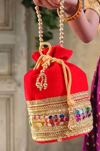 Red silk designer potli bag – golden embroidery & pearl handle