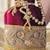 Maroon silk designer potli bag with golden embroidery and pearl handle