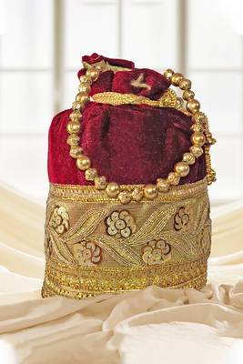 Maroon silk designer potli bag with golden embroidery and pearl handle 4