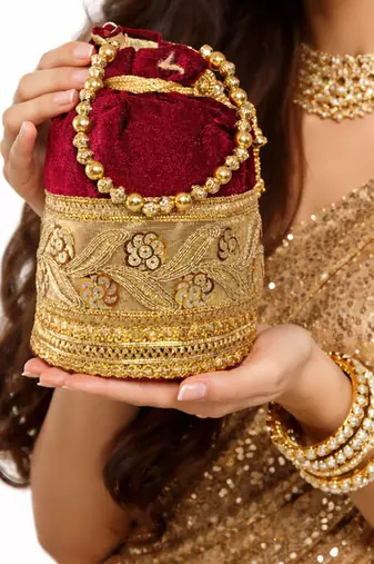 Maroon silk designer potli bag with golden embroidery and pearl handle