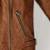 Women’s brown leather cropped jacket minimalist zip detail slim fit style