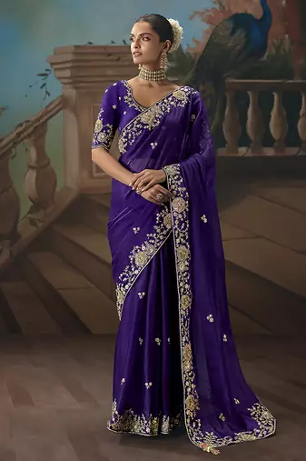 Purple fancy fabric saree with embroidered work