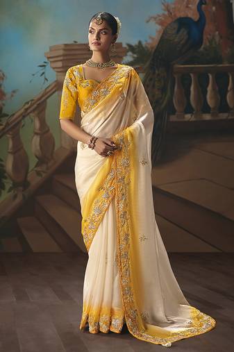 Cream fancy fabric saree with embroidered work