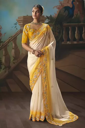 Cream fancy fabric saree with embroidered work