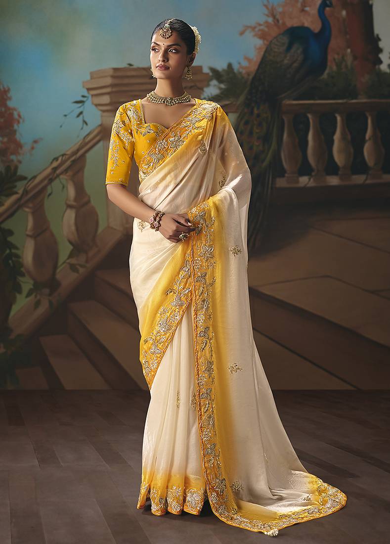 Cream fancy fabric saree with embroidered work