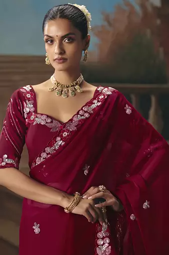 Maroon fancy fabric saree with embroidered work