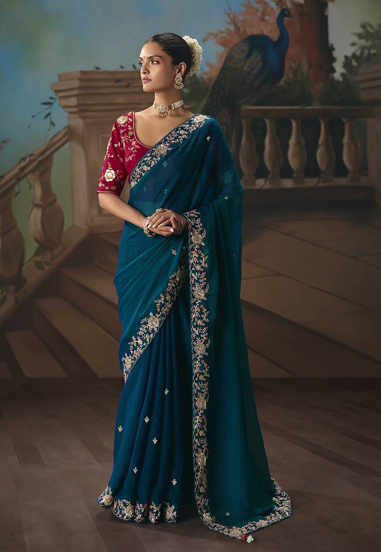 Teal blue fancy fabric saree with embroidered work