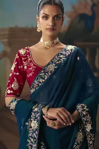 Teal blue fancy fabric saree with embroidered work