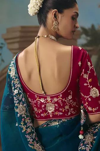 Teal blue fancy fabric saree with embroidered work