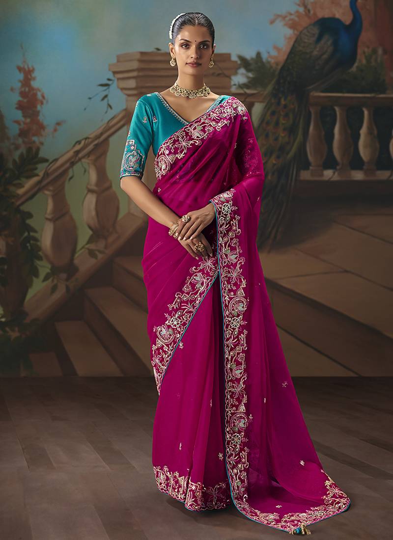 Rani pink fancy fabric saree with embroidered work