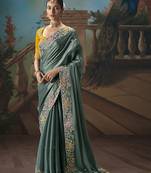 Teal fancy fabric saree with embroidered work