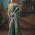 Teal fancy fabric saree with embroidered work