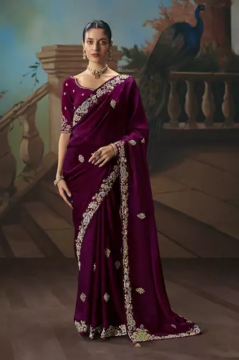 Wine fancy fabric saree with embroidered work