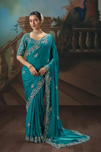 Aqua blue fancy fabric saree with embroidered work