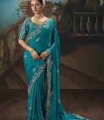 Aqua blue fancy fabric saree with embroidered work