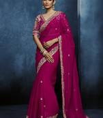 Rani pink fancy fabric embroidered saree with stiched blouse