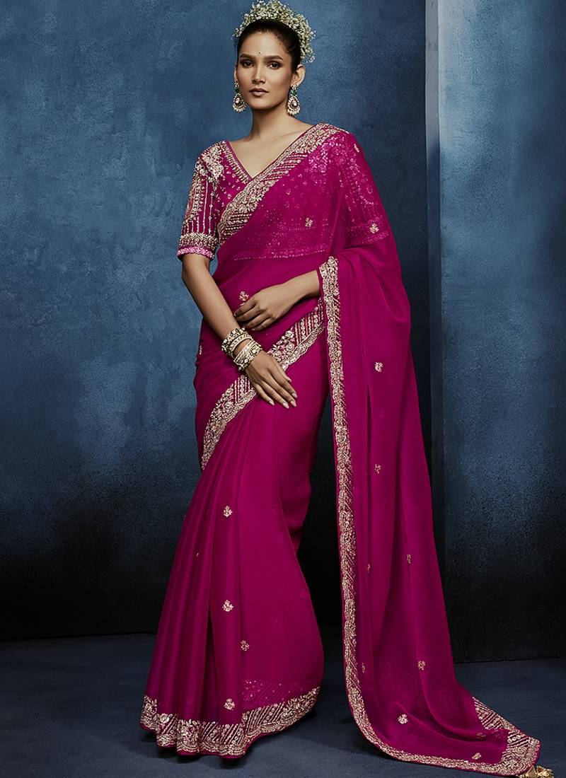 Rani pink fancy fabric embroidered saree with stiched blouse