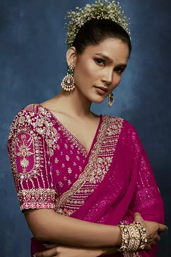 Rani pink fancy fabric embroidered saree with stiched blouse