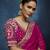 Rani pink fancy fabric embroidered saree with stiched blouse