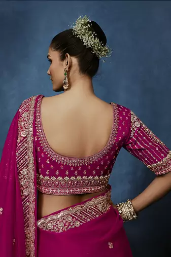 Rani pink fancy fabric embroidered saree with stiched blouse