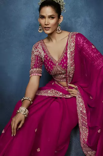 Rani pink fancy fabric embroidered saree with stiched blouse