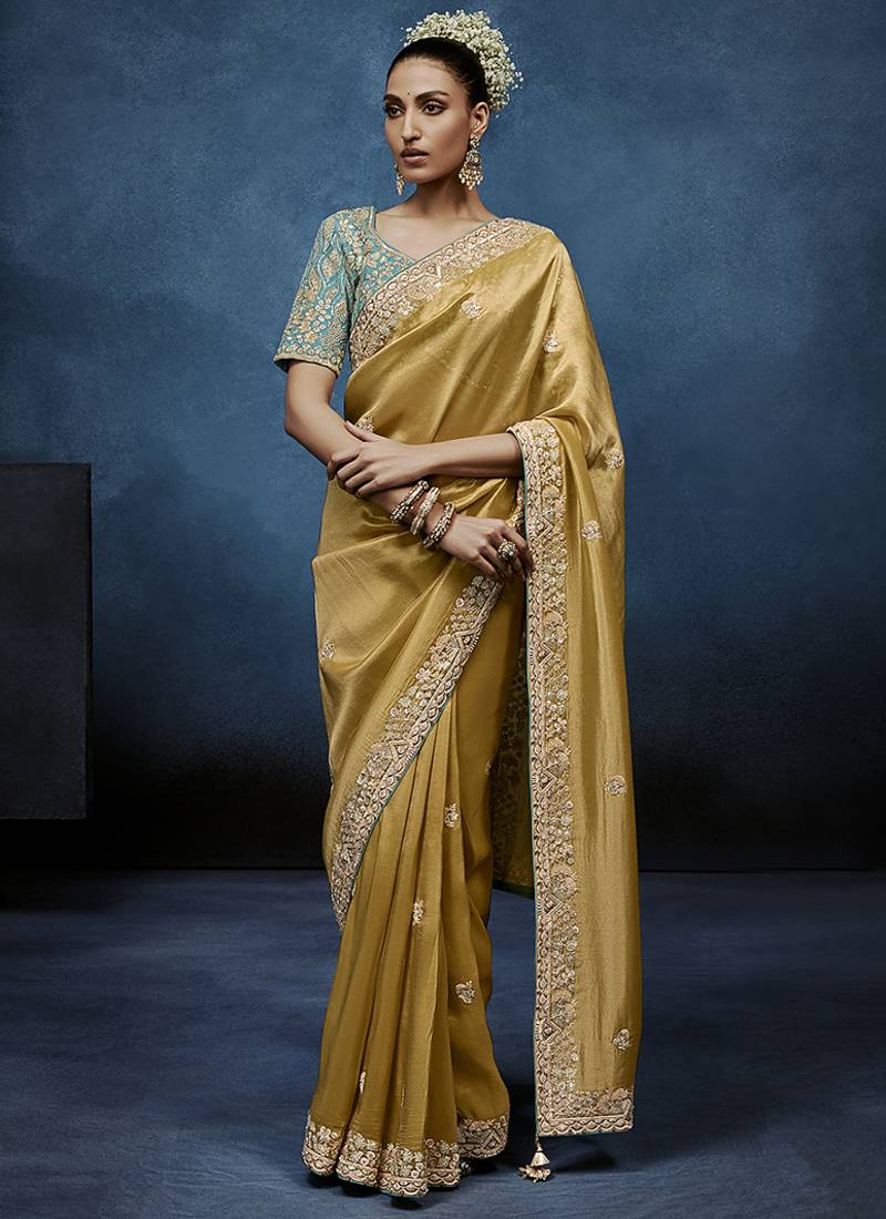 Gold fancy fabric embroidered saree with stiched blouse