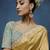 Gold fancy fabric embroidered saree with stiched blouse
