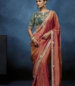 Rust fancy fabric embroidered saree with stiched blouse