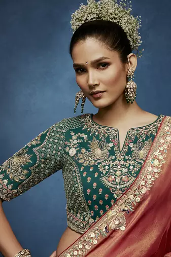 Rust fancy fabric embroidered saree with stiched blouse