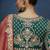 Rust fancy fabric embroidered saree with stiched blouse