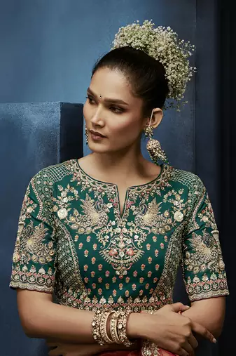 Rust fancy fabric embroidered saree with stiched blouse