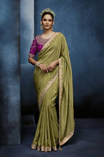 Light green fancy fabric embroidered saree with stiched blouse