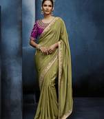 Light green fancy fabric embroidered saree with stiched blouse