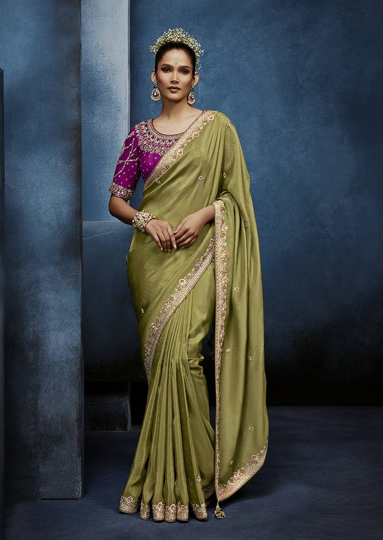 Light green fancy fabric embroidered saree with stiched blouse