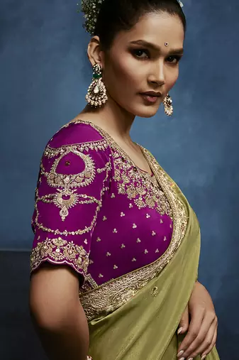 Light green fancy fabric embroidered saree with stiched blouse