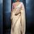 Cream fancy fabric embroidered saree with stiched blouse